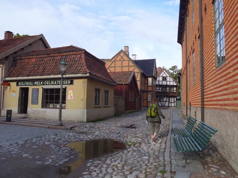 Norma walking on cobblestone road