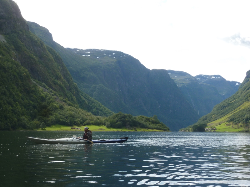 Me in the kayak with mountains all around