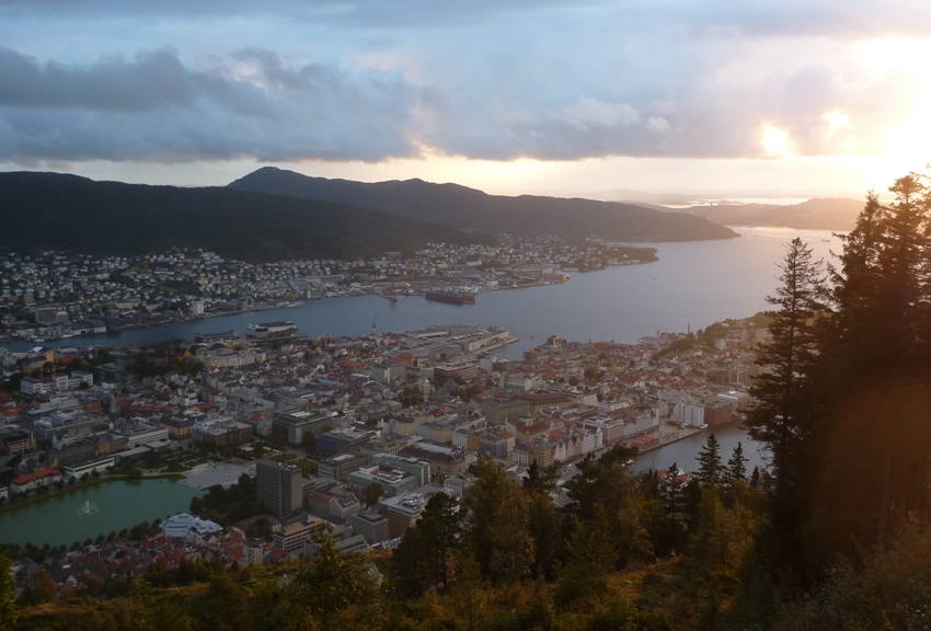 Cloudy sunset looking down on city and bay