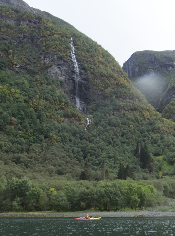 Kayaker and waterfall