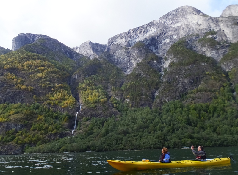 Two European kayakers and waterfall