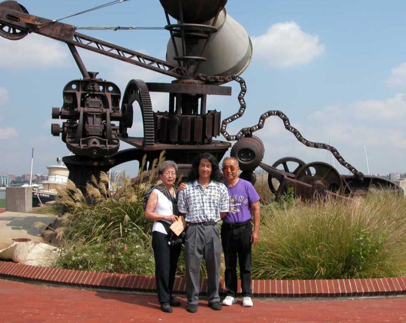 My folks and I in front of the abstract metal sculpture