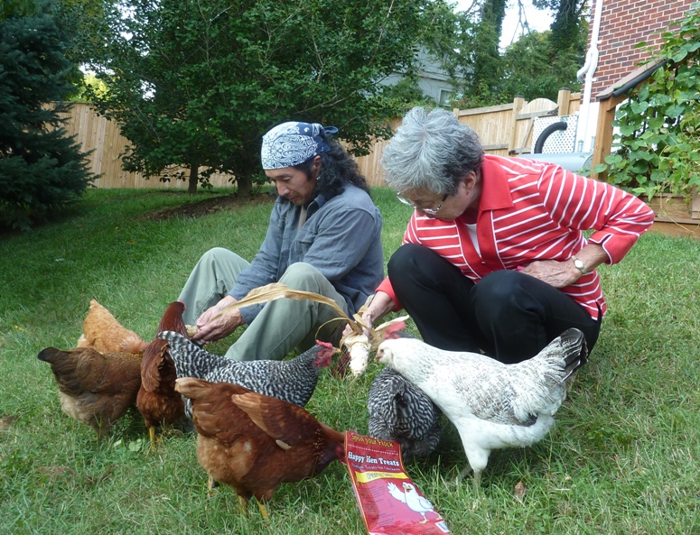 Mom and I feeding chickens