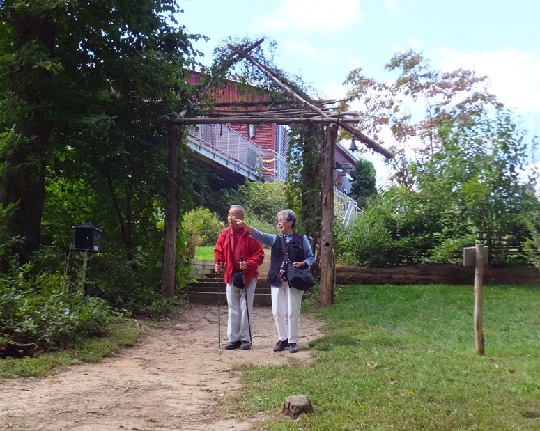 Mom and dad outside on a dirt path