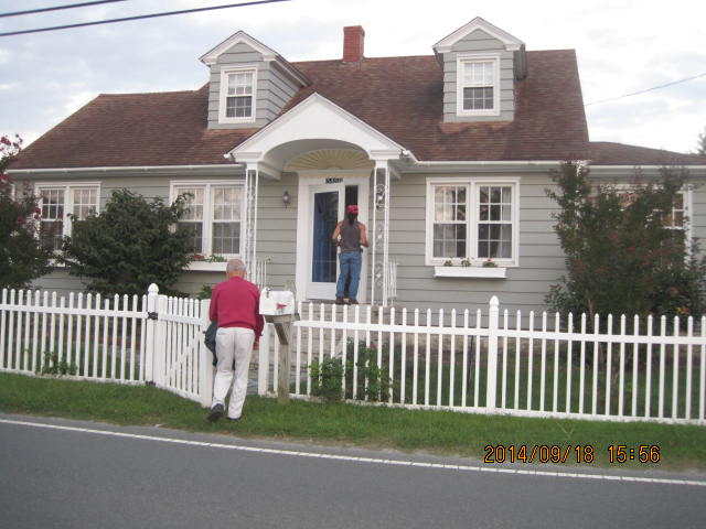 Vacation house with me at the door and Dad at the gate