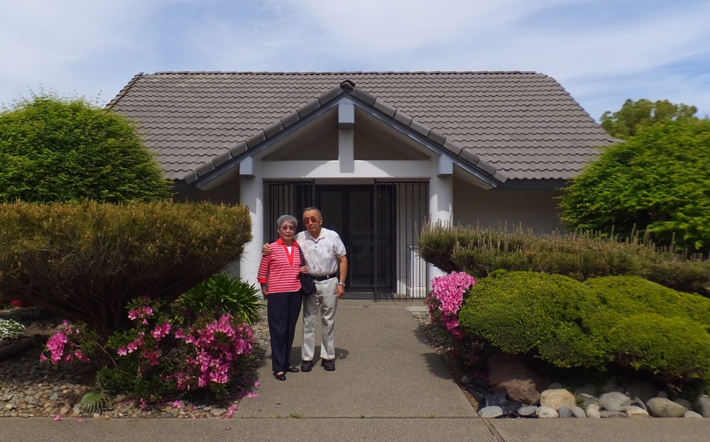 My parents in front of building housing cremated remains