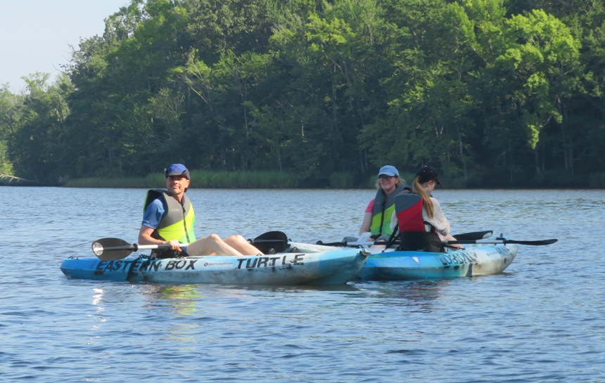 Mark, Allison, and their daughter in their kayaks