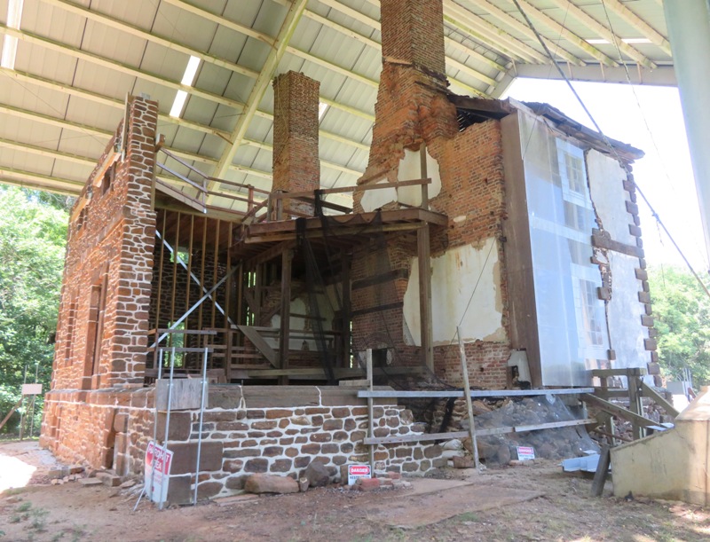 Section of house currently under reconstruction along with area with some glass