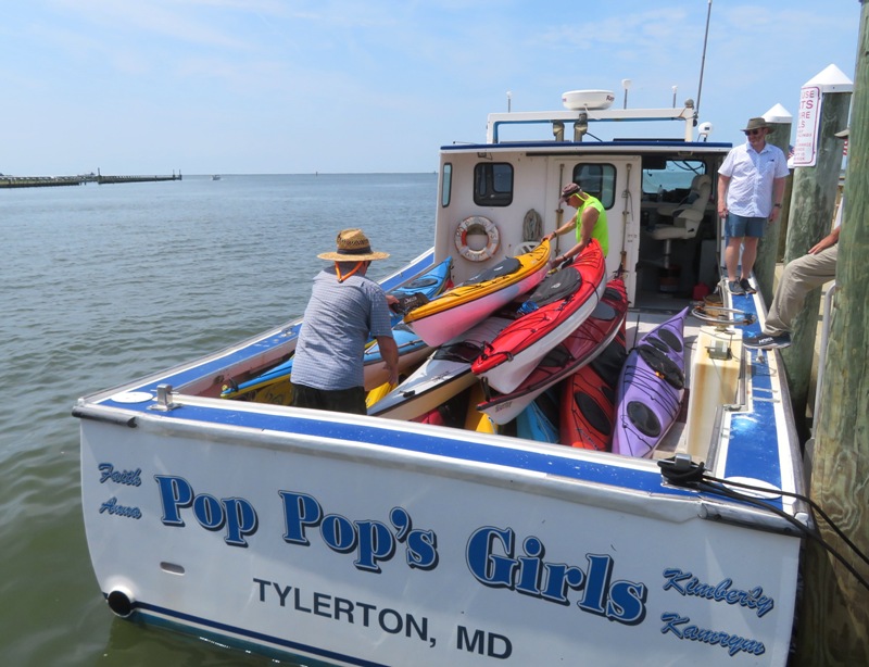 Loading kayaks on the power boat