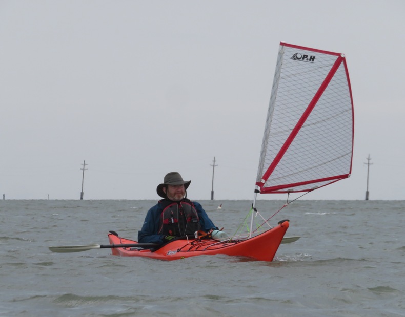 Mike with a sail on his kayak