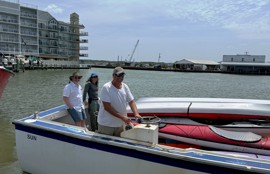 The Captain, Mike, and me on the boat carrying the kayaks