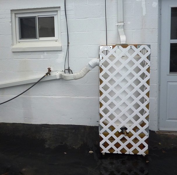 Rain barrel enclose in PVC lattice