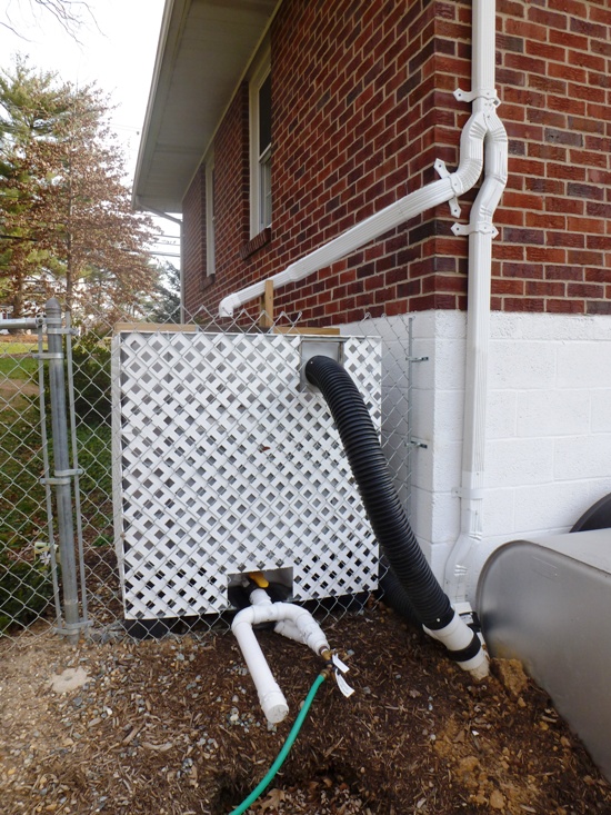 Rain box enclosed in PVC lattice on north side of our property