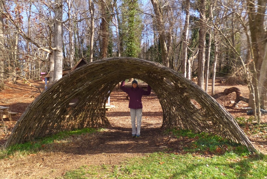 Carmen under a dome made of woven twigs