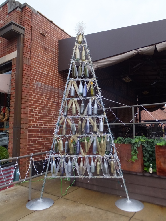 Triangular-shaped rack with hanging bottles