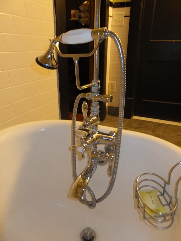 Gold-colored pipes of shower/bath