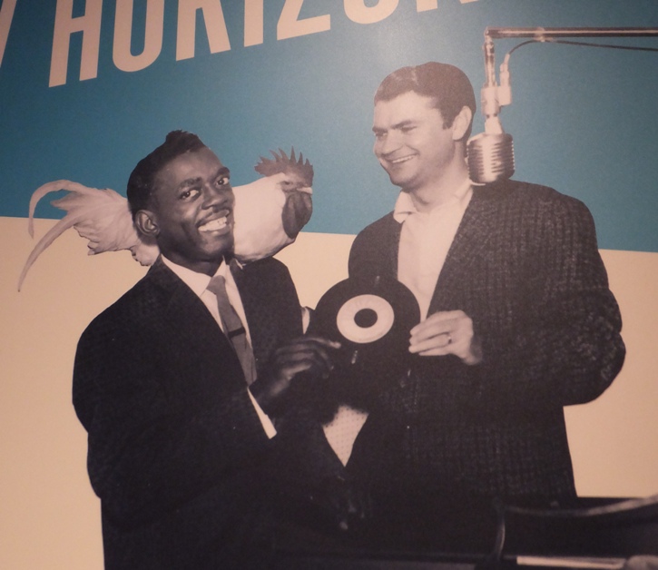 Sam Phillips, Rosco Gordon, and white chicken on the shoulder of the latter