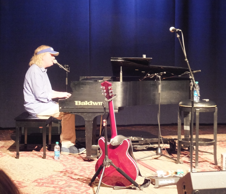 Joe Doyle singing and playing the piano