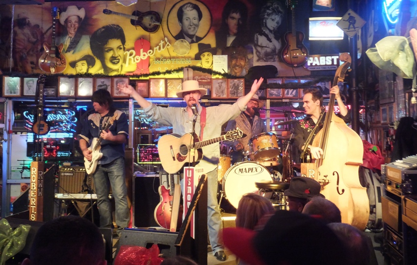 Three guitarists at The Big Bang Dueling Pianos