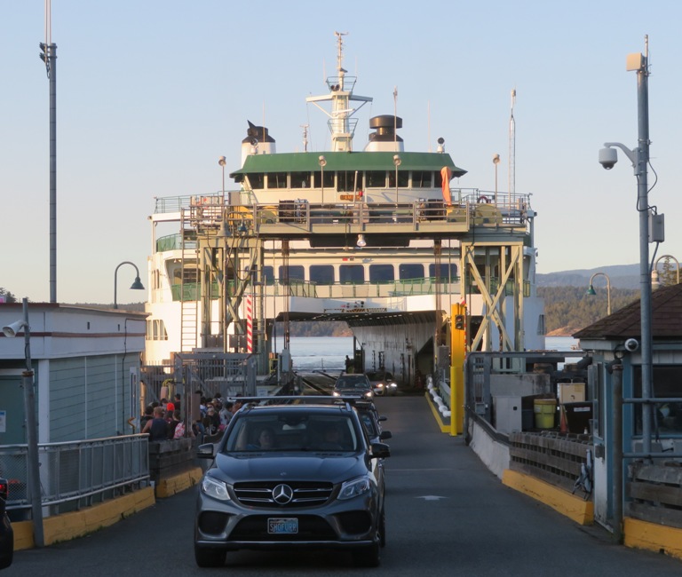 Cars driving off the ferry