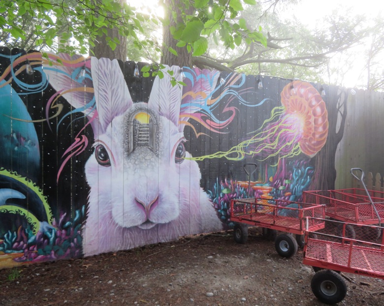 Rabbit and jellyfish painted on fence