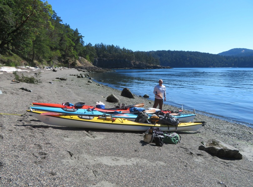 Steve with the kayaks on the beach