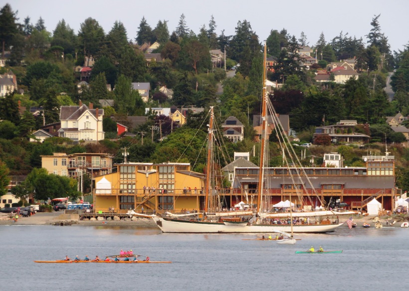 Old sailing ship and rowers in the water at Port Townsend