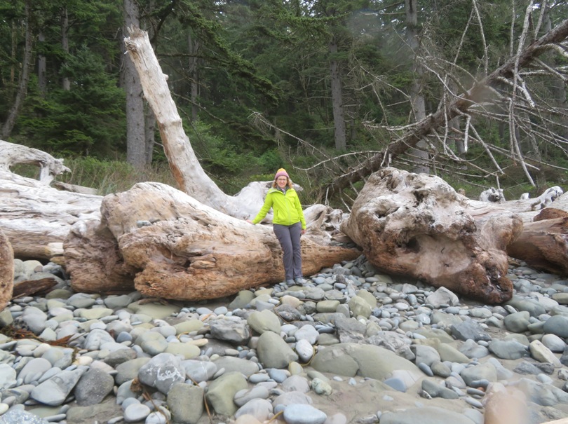 Norma in front of bleached, fallen trees