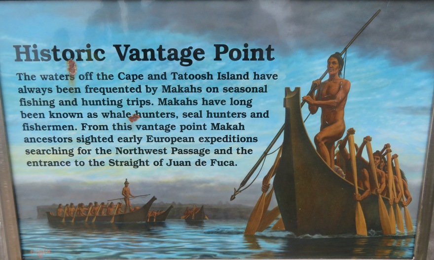 Trail sign showing Makah men in canoe