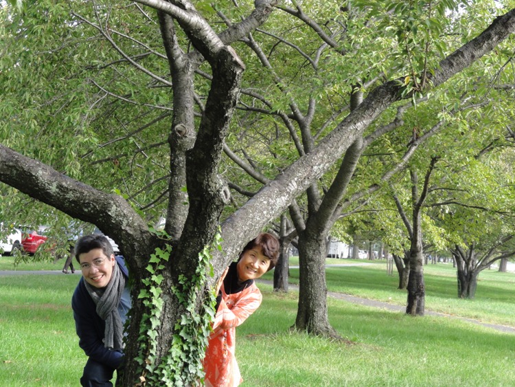 Angelika and Hitomi behind cherry tree