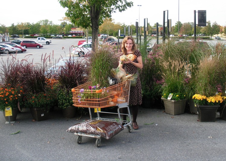 Norma with a cart containing pumpkins