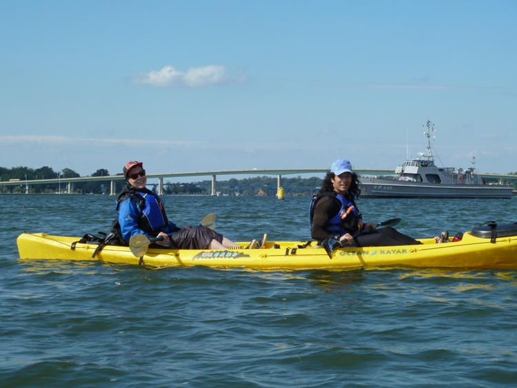 Angelika and I on the tandem with a Navy ship behind