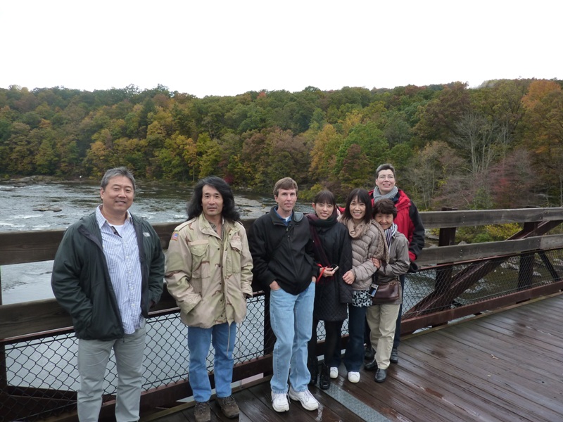 Group photo on bridge over river