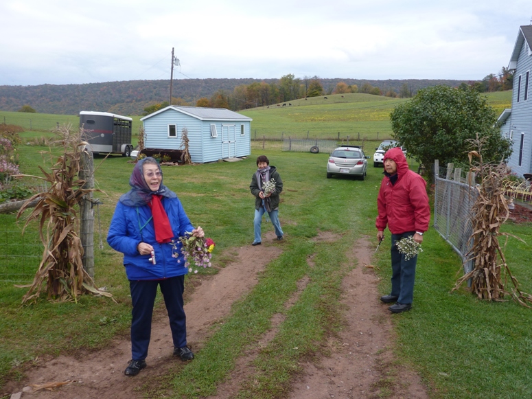 Mom, Dad, and Hitomi on farm with flowers