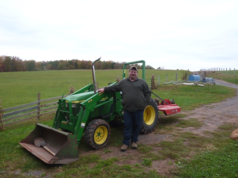 Scott in front of his tractor