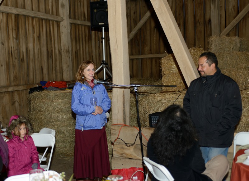 Norma smiling with Jorge at the side