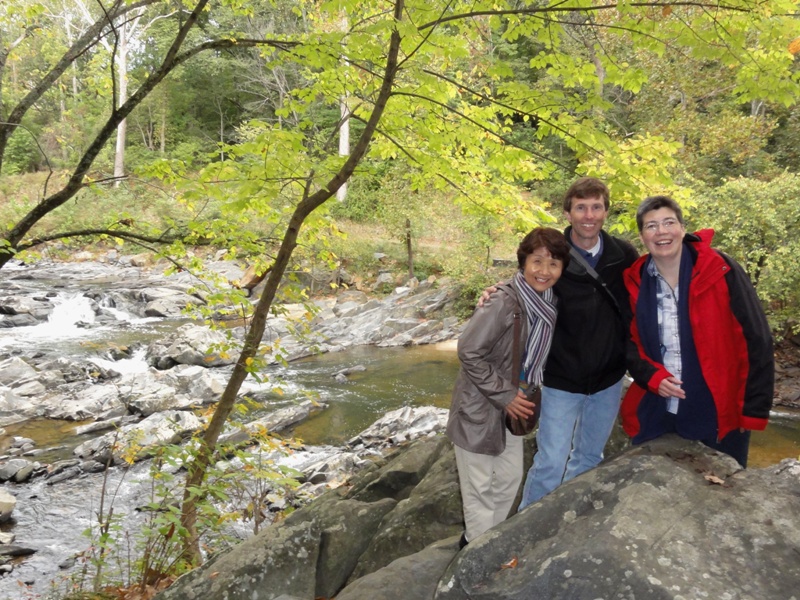 Hitomi, Ken, and Angelika with the Little Patuxent River behind