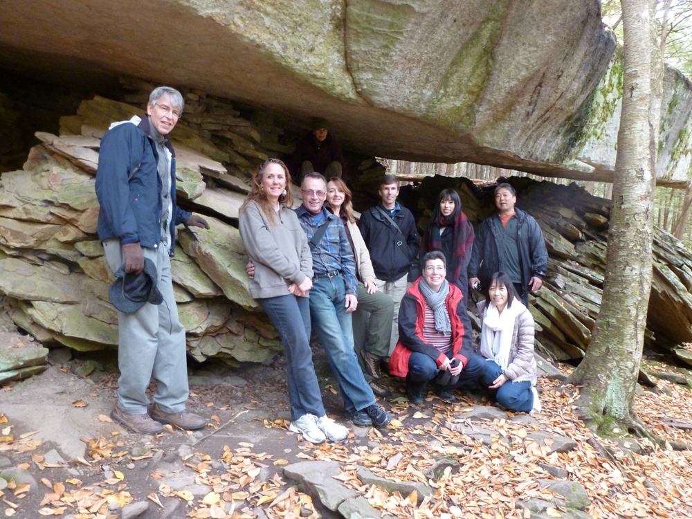 Group photo by cantilevered rock