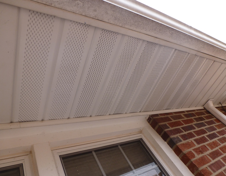 White aluminum soffit covering holes I cut