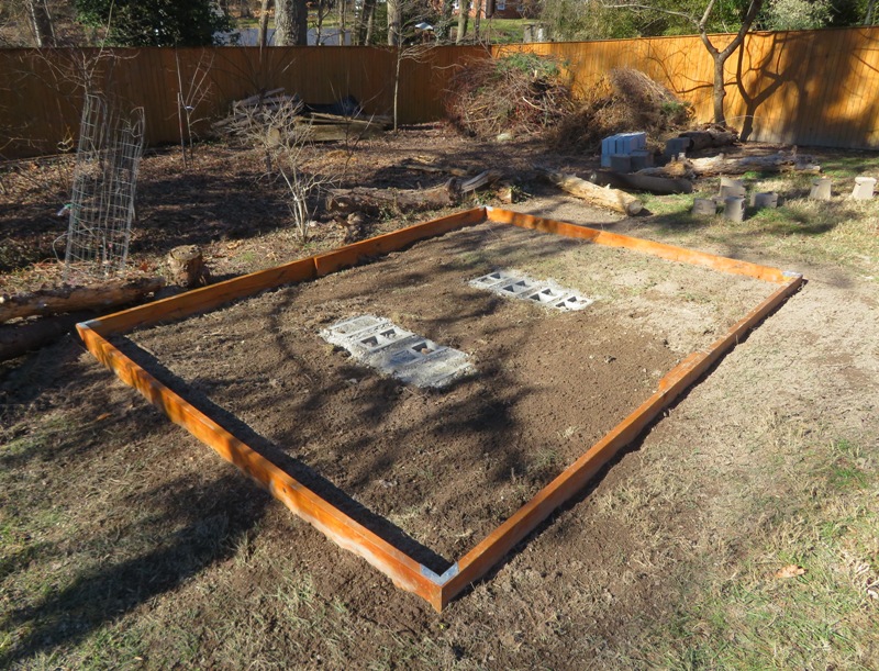 Concrete poured around cinder blocks and border added