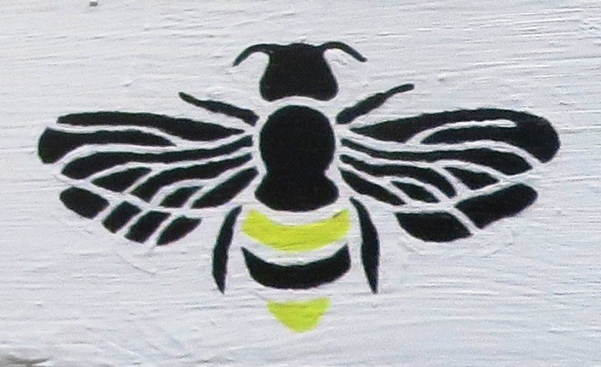 Stenciled bee on top feeder box