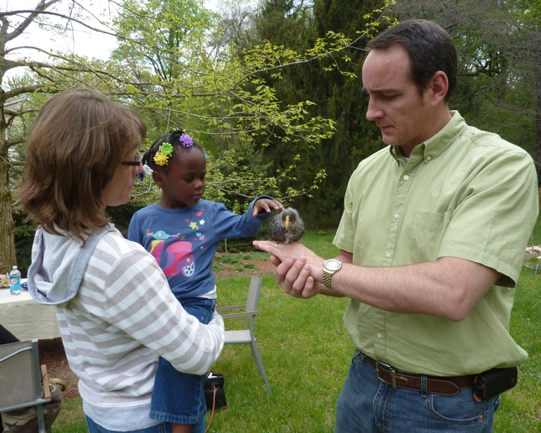 Jimmy holding chick that Harlem pets