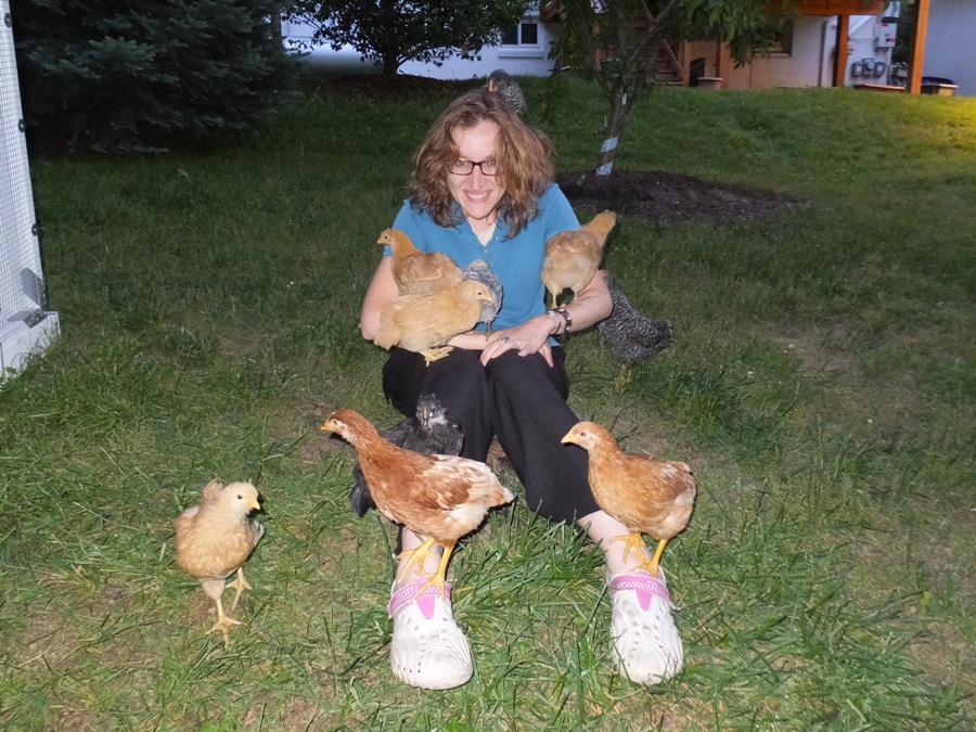 Norma covered in chickens