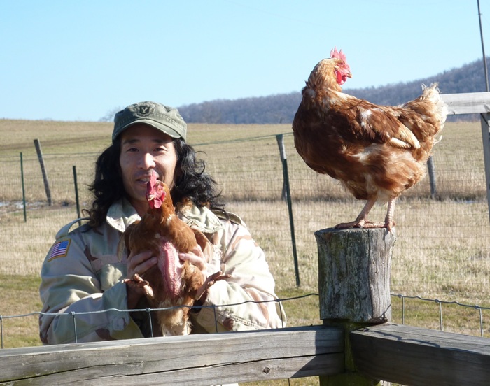 Me with a chicken at Norma's sister's farm