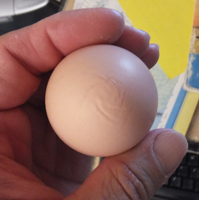 Egg with a swirly pattern on top