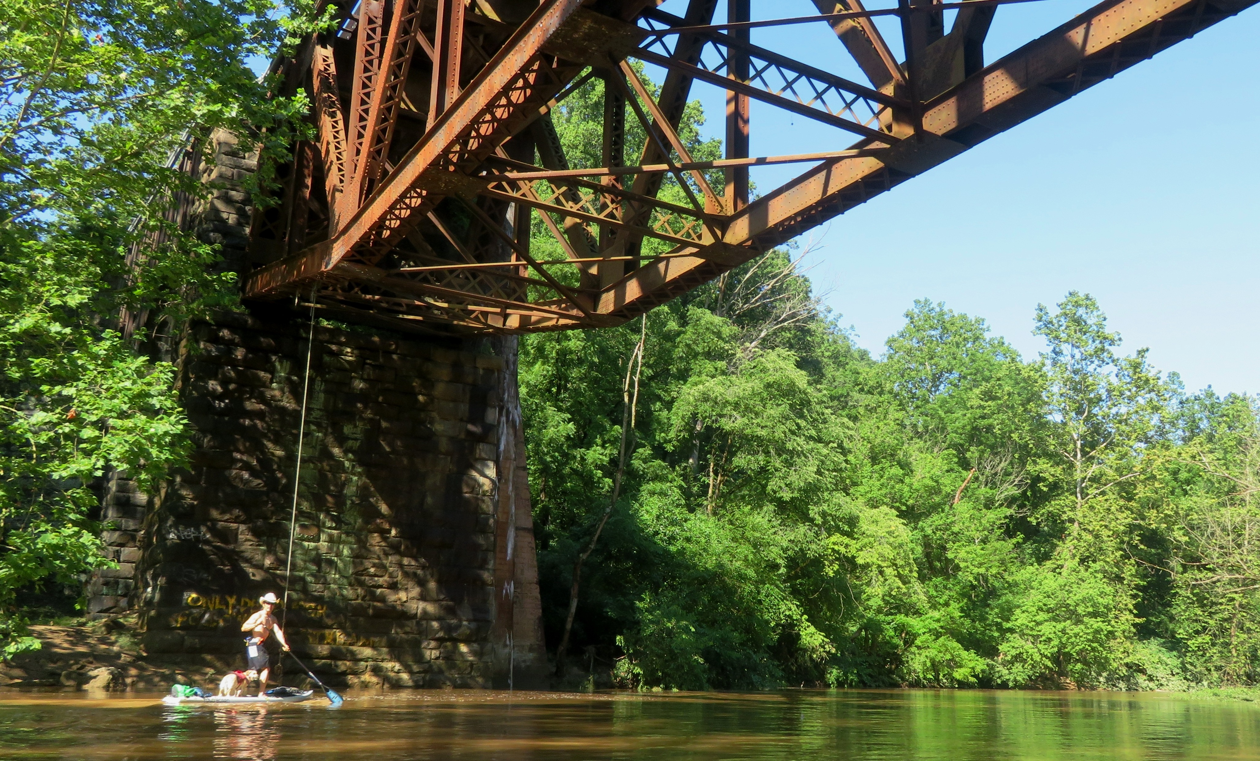 Daphne and I on SUP at train bridge