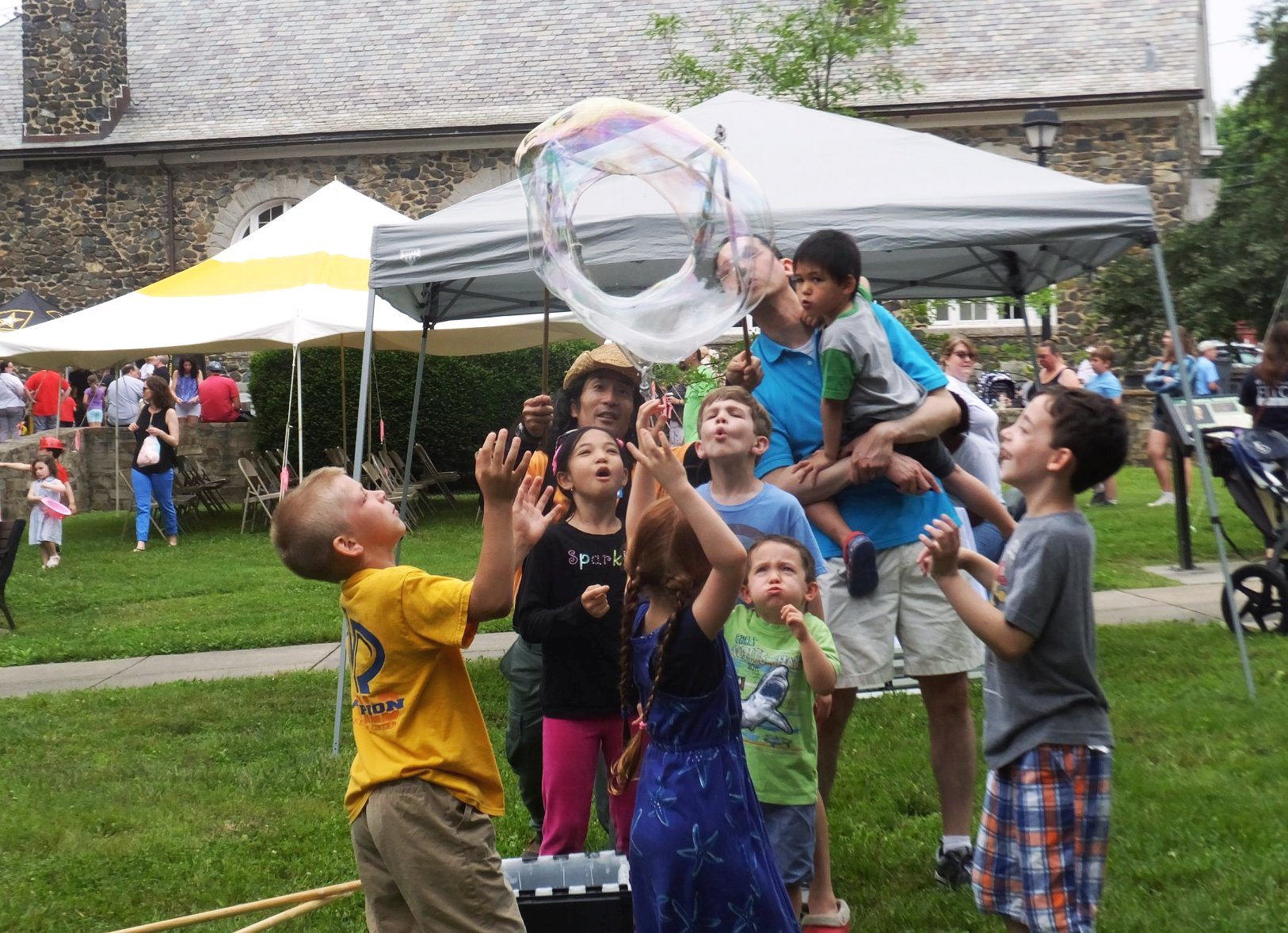 Making bubbles with kids and parent