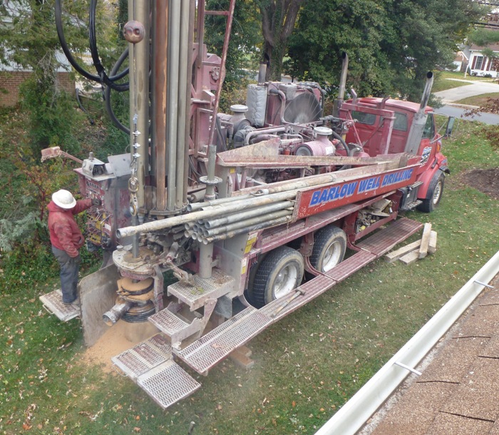 Drilling machine pulling up dirt