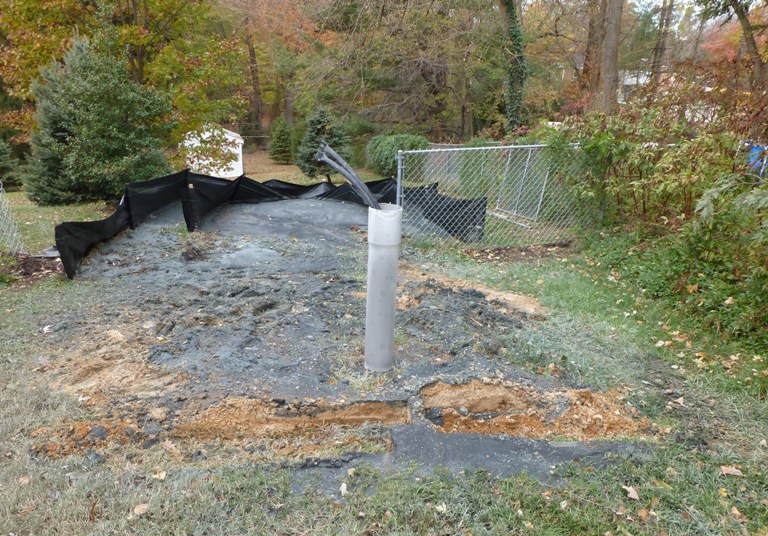 Pipes sticking out of well hole