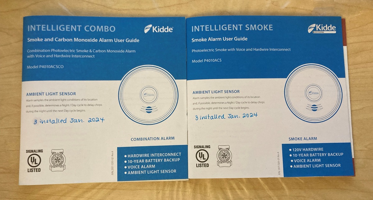 Covers of smoke and carbon monoxide alarm manuals